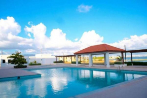 Sunshine Beachfront Studio with a Pool